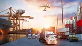 Container truck in ship port for business Logistics and transportation of Container Cargo ship and Cargo plane with working crane bridge in shipyard at sunrise, logistic import export and transport industry background