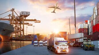 Container truck in ship port for business Logistics and transportation of Container Cargo ship and Cargo plane with working crane bridge in shipyard at sunrise, logistic import export and transport industry background