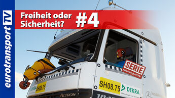 Crash-Test-Szene mit einem Lkw-Fahrerhaus und einem gelben Dummy, der aus der geöffneten Fahrerkabine nach vorne hängt. Sichtbar sind das eurotransportTV-Logo, der Serienstempel sowie die Schrifteinblendung „Freiheit oder Sicherheit #4“.
