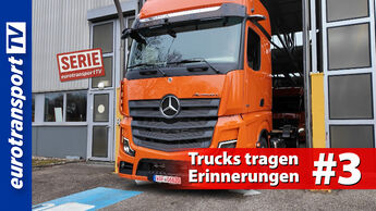Ein orangefarbener Mercedes-Benz Actros fährt aus der Halle, Blick frontal auf den Kühlergrill. Links das eurotransportTV-Logo, rechts der Serien-Stempel sowie der Titel „Trucks tragen Erinnerungen #3“.