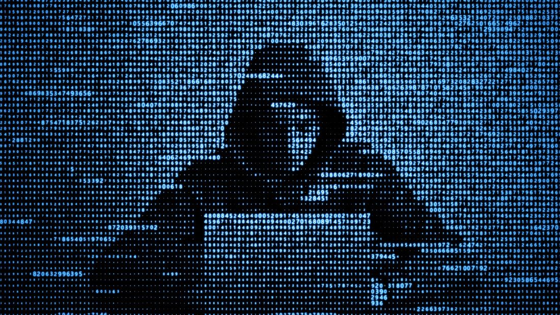 Hacker in data security concept. Hacker using laptop. Hacking the Internet. Cyber attack.