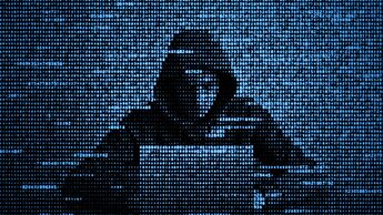 Hacker in data security concept. Hacker using laptop. Hacking the Internet. Cyber attack.