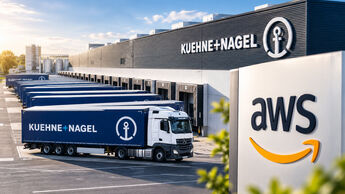 Kühne+Nagel-Logistikzentrum mit Lkw und AWS-Logo. Kühne+Nagel vereinbart eine langfristige strategische Zusammenarbeit mit Amazon.