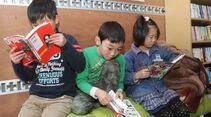 Lesende Kinder