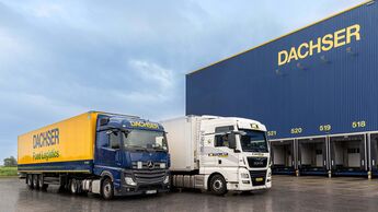 Lkw von Dachser und Müller Fresh Food Logistics vor Halle