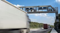 Truck toll system, german highway - control gantry, motion blur on truck